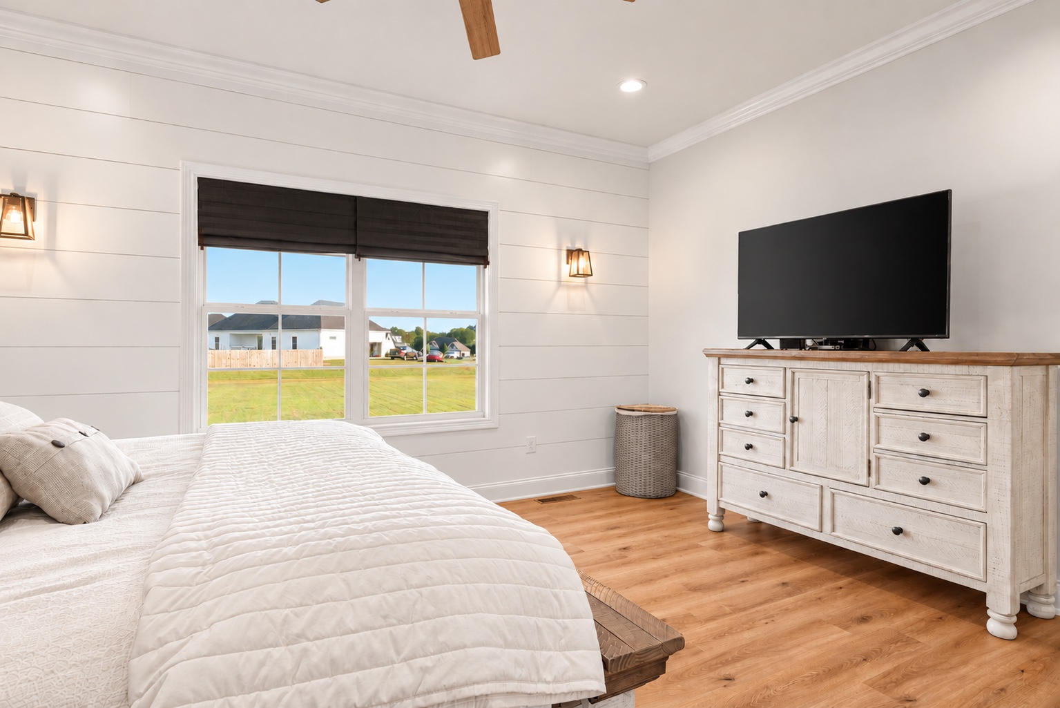Primary bedroom at 23 Cornerstone Dr with a wide backyard-facing window