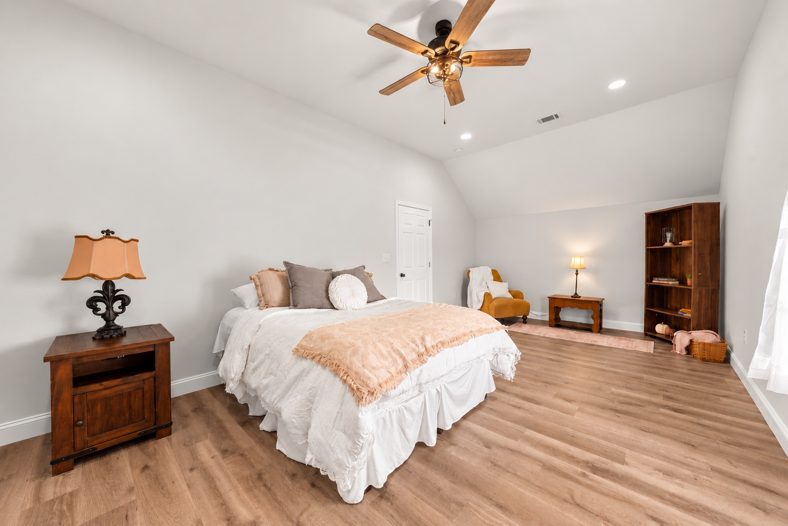 Bedroom at 23 Cornerstone Dr with wood flooring and a vaulted ceiling