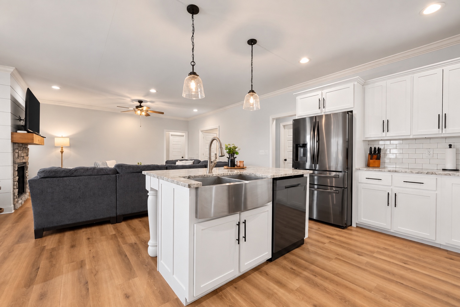 Wide view of the white kitchen and island at 23 Cornerstone Dr