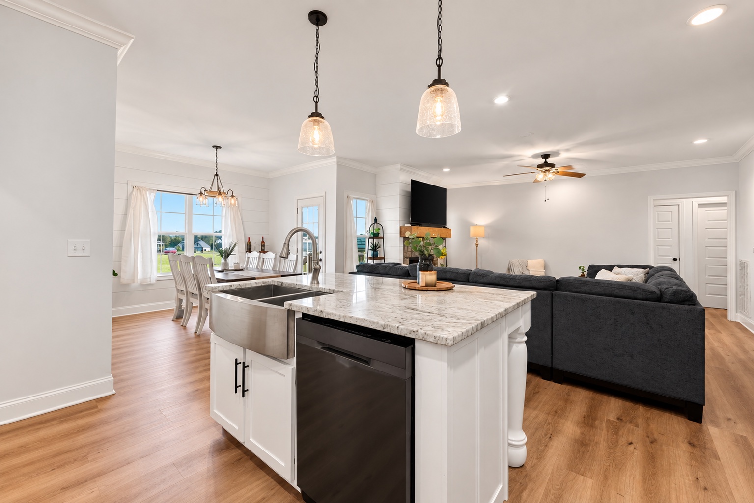 Kitchen island at 23 Cornerstone Dr opening to the dining and living areas