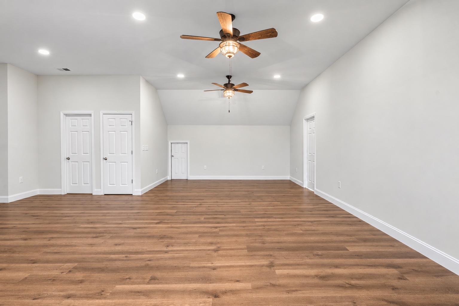 Wide view of the unfurnished bonus room on the finished upper level at 23 Cornerstone Dr