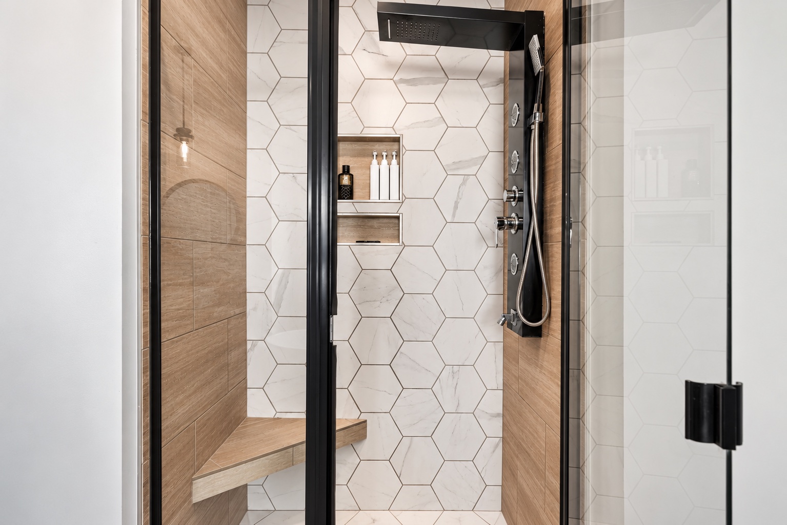 Tile and fixture details in the primary shower at 23 Cornerstone Dr