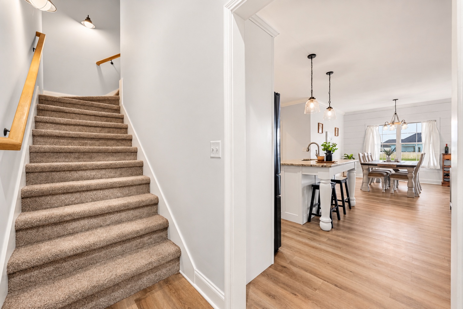 Stairs leading from the main level to the finished upper level at 23 Cornerstone Dr
