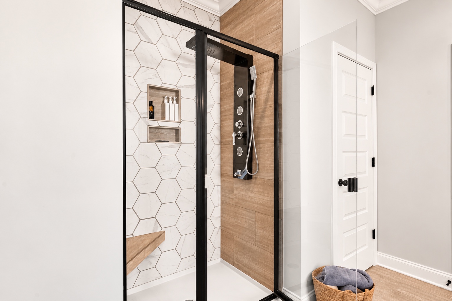 Glass-enclosed tiled shower in the primary bathroom at 23 Cornerstone Dr