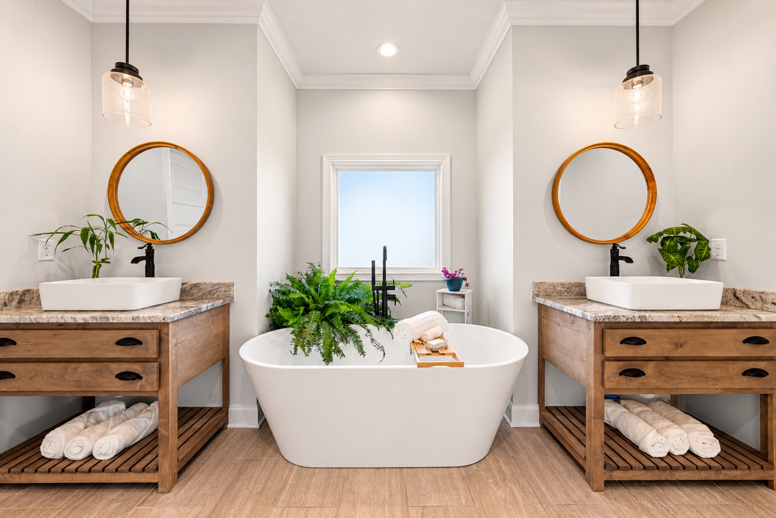 Primary bathroom at 23 Cornerstone Dr with two vanities and a freestanding tub